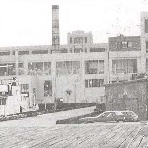 Alexandria Naval Torpedo Station with ferry and cars, black-and-white photograph